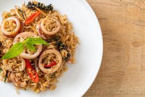 Homemade basil and spicy herb fried rice with squid or octopus - Asian food style photo