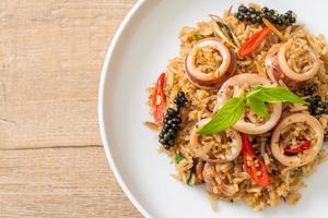 Homemade basil and spicy herb fried rice with squid or octopus - Asian food style photo