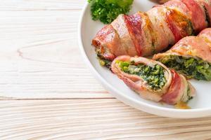 Baked bacon roll stuffed spinach and cheese photo