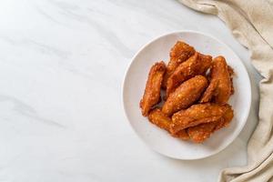 Deep-fried sliced potatoes stick with sesame - Thai food style photo