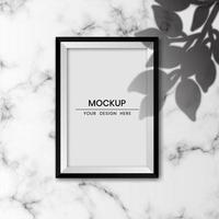 Realistic photo frame mockup with white marble background and shadow overlay effect vector