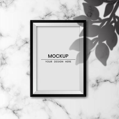 Realistic photo frame mockup with white marble background and shadow overlay effect