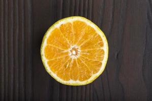 Orange on wood table photo