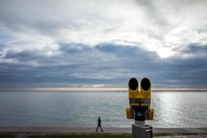 Yellow telescope at the south beach in Wilhelmshaven in Germany photo