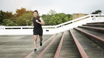 Handsome Sport man running at outdoor city photo
