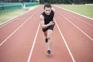 Handsome Sport man running at outdoor city photo