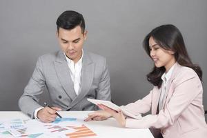 Businessman and businesswoman are analytic graph ,Business plan and business meeting concept photo