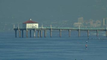 The Manhattan Beach Pier in California extends into the Pacific Ocean. video