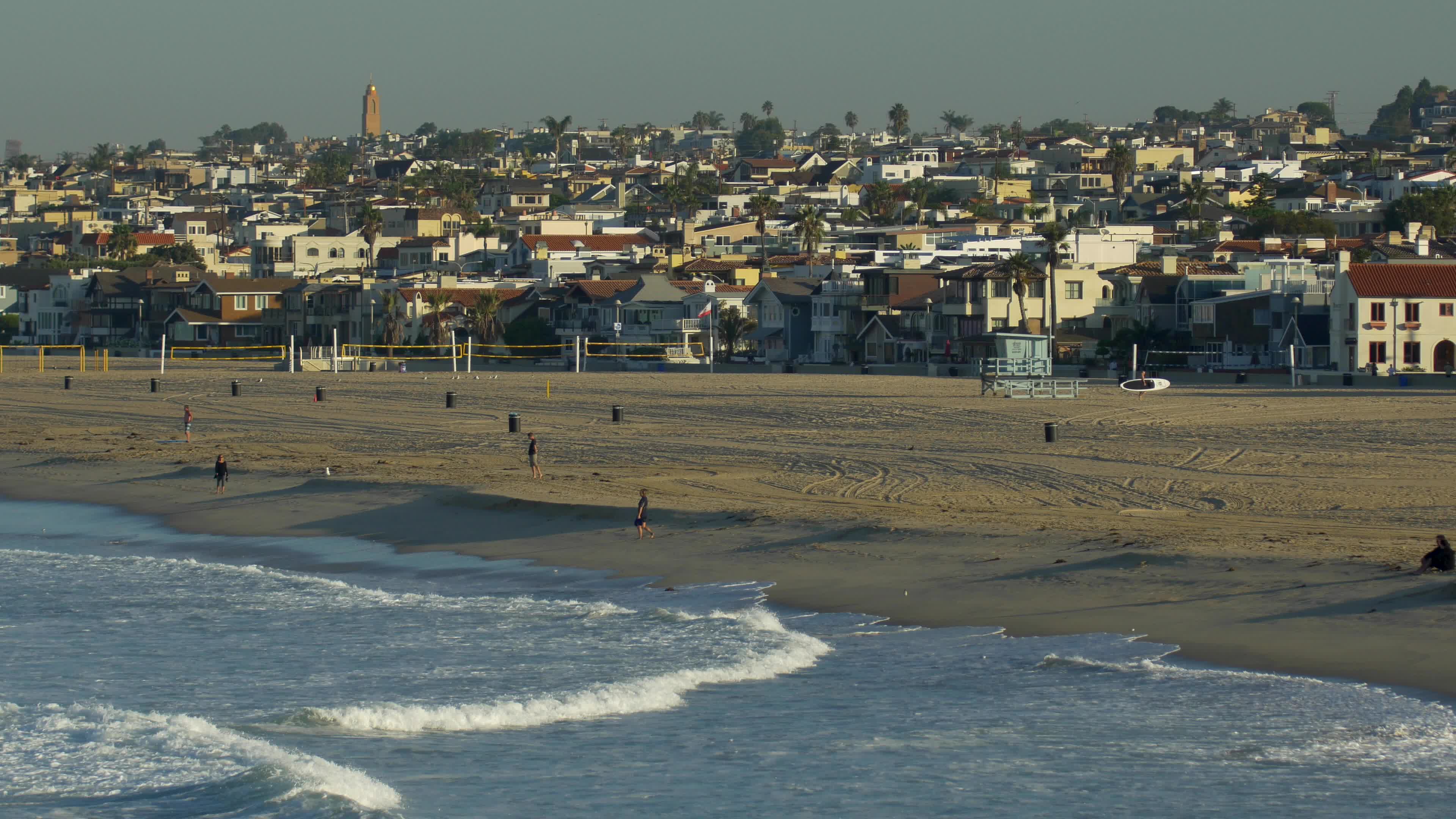 Volleyball courts stand empty on the beach in Hermosa Beach California