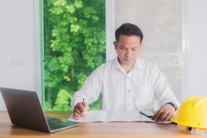 male engineer working in office photo