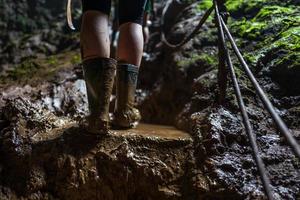 Muddy shoes at Goa Jomblang Tour near Yogyakarta in  Indonesia photo