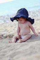 Baby on the beach photo