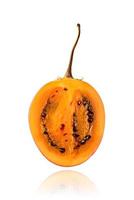 Half of Tamarillo fruit, slice, isolated on white background with drop shadow. photo