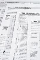 Form 1040 Individual Income Tax return form. United States Tax forms. American blank tax forms. Tax time. photo