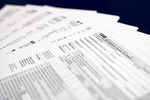 Form 1040 Individual Income Tax return form. Form 1041 U.S. Income Tax Return for Estates and Trusts. Form 1065 U.S. Return of Partnership Income. Form 1120 U.S. Corporation Income Tax Return.  American blank tax forms. Tax time. photo