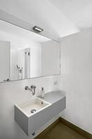 Interior of a Modern Bathroom in the foreground the washbasin photo