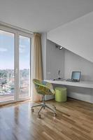 Modern desk and armchair in the children's bedroom photo