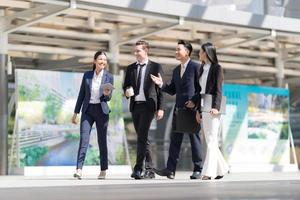 Business people walking and talk to each other photo