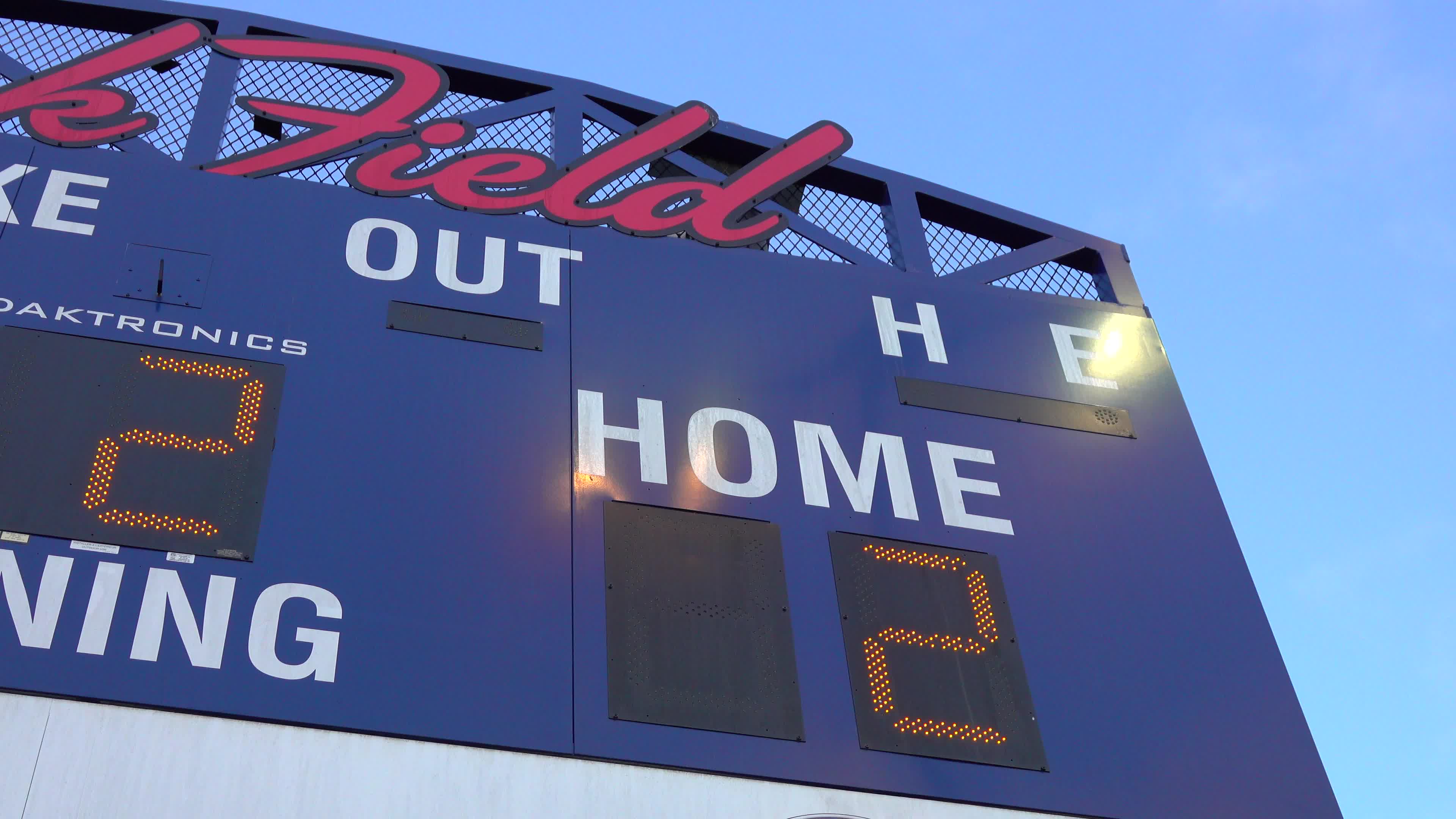 The Scoreboard At A Little League Baseball Game Shows The Score the-scoreboard-at-a-little-league-baseball-game-shows-the-score