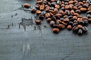 Coffee beans roasted on a black background photo