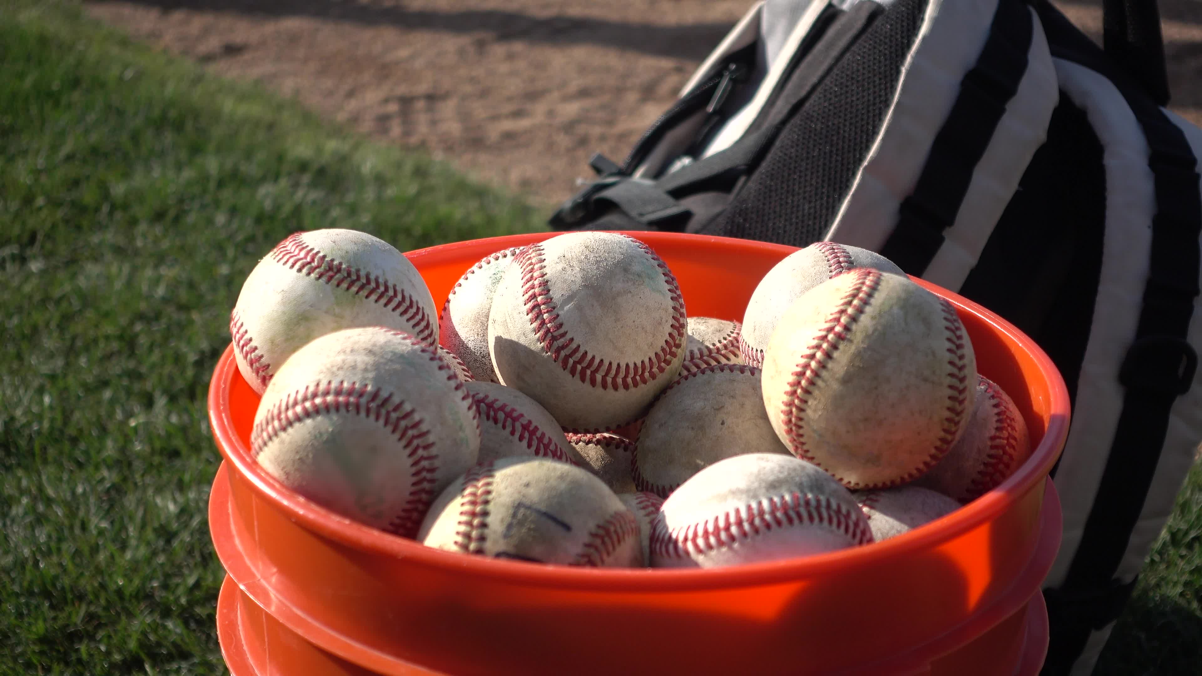 A bucket of balls a little league baseball game. 2636845 Stock Video at