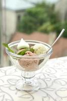 chocolate and pistachio ice cream in glass vase photo