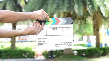 Hand holding movie slate colors board for movie cinema and television industry video