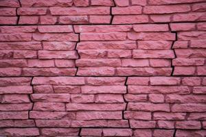 Red brick wall with peeling paint photo