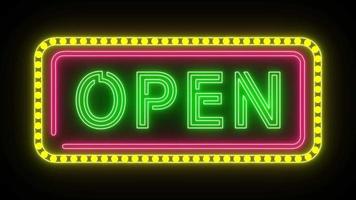 neon sign with the word OPEN flicker use pink and yellow light frame video