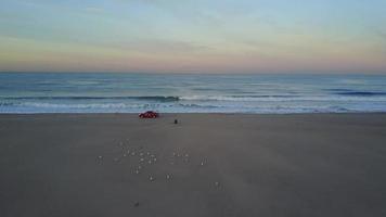 Aerial drone uav view of a lifeguard truck, beach and ocean. video