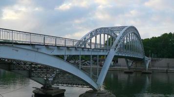 The Passerelle Debilly through arch footbridge bridge across the Seine River. video