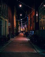 Amsterdam, Netherlands 2018- Colorful alleyway lit up with lights at night in Amsterdam photo