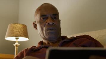 Low angle of mature man using digital tablet photo