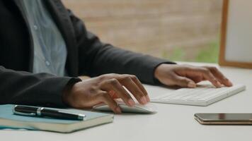 Close up of woman working with computer keyboard and pen photo