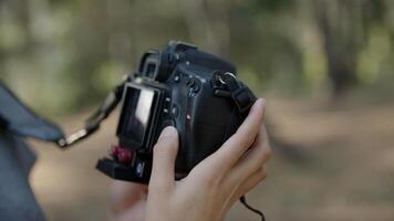 Portrait of woman using slr camera close up photo