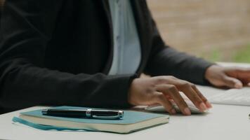 Close up of woman working with computer keyboard and pen photo