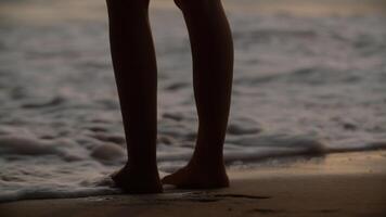 Person standing at sea shore photo