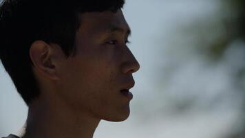 Portrait of mid adult man drinking water after exercise photo