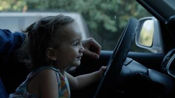 Portrait of girl playing with steering wheel photo