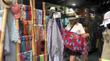 Shopping for scarves in the village of Orvieto, Tuscany, Italy, Europe.