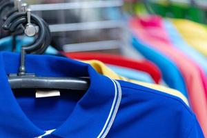 Close up of Colorful polo shirt on hangers photo