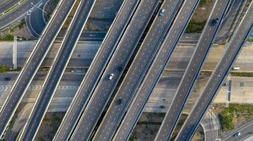 Aerial top view of highway, Transport city junction road with car on Intersection cross road shot by drone photo