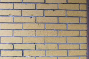 Yellow grunge brick wall photo