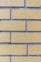 Yellow grunge brick wall photo