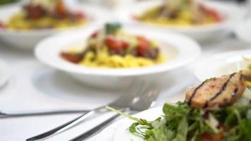 pasta in the plate. table setting in a restaurant video