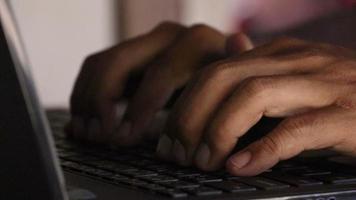 A worker is typing a document on a computer, extreme close up video