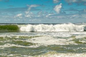 Waves Under a Cloudy Sky photo