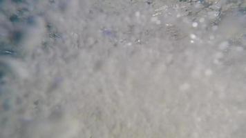 POV of a surfer jumping and diving of a water taxi boat with his surfboard. video