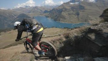 Mountain biker biking downhill in the mountains. video