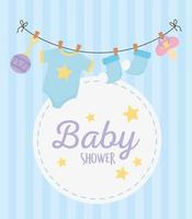 baby shower, hanging socks bodysuit pacifier and rattle round label background vector